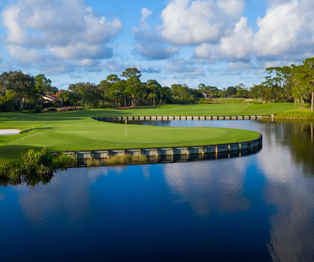 view of golf green from waterway