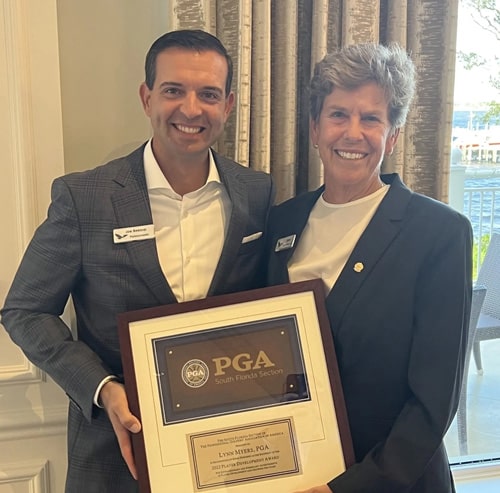 Lynn Myers holding the South Florida PGA Player Development Award