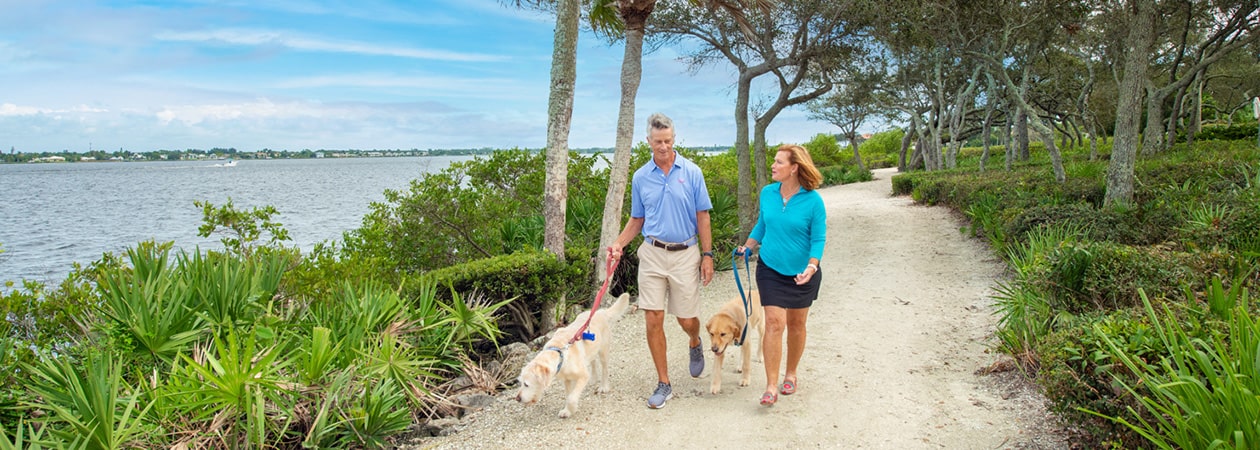 Florida Private Club Harbour Ridge members walking their dog on the waterfront