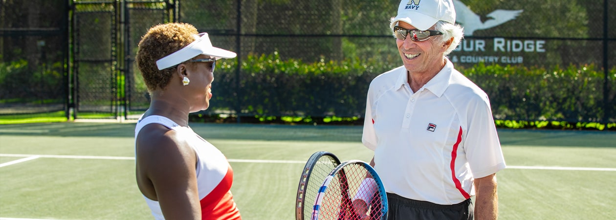 Florida Private Club Harbour Ridge Member talking with tennis instructor